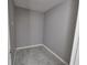 Walk-in closet with gray tile flooring, ready to be customized for storage at 211 Marion Oaks Ln, Ocala, FL 34473