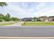Charming single-story home featuring a well-maintained lawn, a long driveway, and a quaint covered entryway at 211 Marion Oaks Ln, Ocala, FL 34473