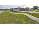 Suburban home with a spacious yard and a well-manicured lawn, situated in a friendly neighborhood setting at 211 Marion Oaks Ln, Ocala, FL 34473