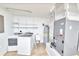 Bright laundry room with new washer/dryer hookups and utility sink at 211 Marion Oaks Ln, Ocala, FL 34473