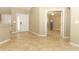 Entryway with tile floors and an open view of the living room through french doors at 212 Regency St, Davenport, FL 33896