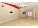 Spacious living room featuring tile floors, a ceiling fan, and access to other rooms at 212 Regency St, Davenport, FL 33896