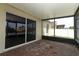 Screened lanai features brick-paved flooring and a sliding glass door for outdoor entertaining at 212 Regency St, Davenport, FL 33896