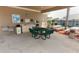 The poolside pavilion includes a sink and prep area, as well as seating for residents to gather and enjoy at 212 Regency St, Davenport, FL 33896