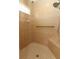 Accessible shower with a built-in bench, safety bar, hand-held and rainfall showerheads at 212 Regency St, Davenport, FL 33896