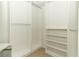 Spacious walk-in closet features ample storage space with shelving and hanging rods at 212 Regency St, Davenport, FL 33896