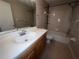 Well-lit bathroom featuring a single sink vanity and shower-tub combination at 2131 Cascades Blvd # 306, Kissimmee, FL 34741
