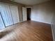 Bedroom with wood-look flooring features a double closet and neutral walls at 2131 Cascades Blvd # 306, Kissimmee, FL 34741