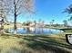 Scenic view of a pond with a fountain in a lush green common area at 2131 Cascades Blvd # 306, Kissimmee, FL 34741