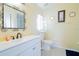 Bathroom showcases a large vanity with a white sink, and a decorative mirror at 2709 Prestwick Ln, Kissimmee, FL 34744