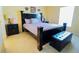 Bedroom featuring a decorative headboard bed frame, and matching dressers at 2709 Prestwick Ln, Kissimmee, FL 34744