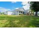 Charming single-story home with a well-manicured lawn, white picket fence, and a cozy front porch at 2709 Prestwick Ln, Kissimmee, FL 34744