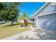 Exterior showcasing the home's siding, garage, landscaping and front yard in a residential neighborhood at 2709 Prestwick Ln, Kissimmee, FL 34744