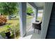 View of the home's covered front porch with seating, offering a cozy spot to enjoy the outdoors at 2709 Prestwick Ln, Kissimmee, FL 34744