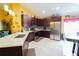 Well-lit kitchen features stainless steel appliances, dark wood cabinets and breakfast nook at 2709 Prestwick Ln, Kissimmee, FL 34744