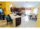 Spacious eat-in kitchen features stainless steel appliances, dark cabinets, and a breakfast bar at 2709 Prestwick Ln, Kissimmee, FL 34744