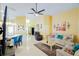 Spacious living room featuring tile floors, ceiling fan, and comfortable seating arrangement at 2709 Prestwick Ln, Kissimmee, FL 34744