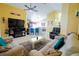 Spacious living room featuring tile floors, ceiling fan, and comfortable seating arrangement at 2709 Prestwick Ln, Kissimmee, FL 34744