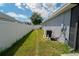 Side yard area with well-maintained lawn and white fence, adding to the property's appeal at 2709 Prestwick Ln, Kissimmee, FL 34744