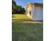 The property features a grass lawn and an attached garage at 3040 Pinder Ct, Orlando, FL 32811
