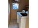 Small laundry room features tiled floors, a window and a washer/dryer set at 3040 Pinder Ct, Orlando, FL 32811