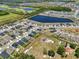 Stunning aerial view of neighborhood featuring a lake and green spaces at 3222 Sweet Acres Pl, St Cloud, FL 34772
