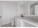 Bathroom features granite counters and vanity with white shaker cabinets at 3222 Sweet Acres Pl, St Cloud, FL 34772