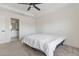 Bedroom featuring tray ceilings and a door leading to the bathroom at 3222 Sweet Acres Pl, St Cloud, FL 34772