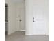 Inviting entryway with a white front door, neutral walls, and tile flooring, leading to other rooms in the home at 3222 Sweet Acres Pl, St Cloud, FL 34772
