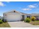 Lovely home with a two-car garage, well-maintained lawn and beautiful landscaping at 3222 Sweet Acres Pl, St Cloud, FL 34772