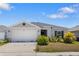 Charming single-Gathering home with an attached two-car garage and manicured landscaping at 3222 Sweet Acres Pl, St Cloud, FL 34772