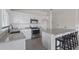 Bright kitchen featuring white cabinets, stainless steel appliances, granite countertops, and an island with seating at 3222 Sweet Acres Pl, St Cloud, FL 34772