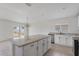 Kitchen features granite countertops, stainless appliances and island seating at 3222 Sweet Acres Pl, St Cloud, FL 34772