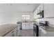 Bright kitchen features granite counters, stainless appliances and white cabinetry at 3222 Sweet Acres Pl, St Cloud, FL 34772