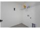 A functional laundry room with tile floors and storage shelving at 3222 Sweet Acres Pl, St Cloud, FL 34772