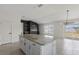 Open floor plan with island, fireplace feature, and sliding doors to the yard at 3222 Sweet Acres Pl, St Cloud, FL 34772