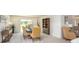 Well-lit dining room featuring stylish furnishings, neutral tones, and large windows for a bright, airy feel at 3238 Viceroy Ct, Poinciana, FL 34759
