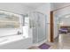 Bright bathroom with a shower, large tub, and stained glass window at 329 Alegriano Ct, Kissimmee, FL 34758