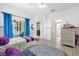 Spacious bedroom with access to the patio and tile flooring at 329 Alegriano Ct, Kissimmee, FL 34758