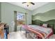 Inviting bedroom featuring two beds and a decorative accent wall at 329 Alegriano Ct, Kissimmee, FL 34758