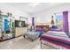 Bright bedroom with tile floors, two beds, and natural light at 329 Alegriano Ct, Kissimmee, FL 34758