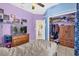 Comfortable bedroom with TV, closet, and an ensuite bathroom in a vibrant color scheme at 329 Alegriano Ct, Kissimmee, FL 34758