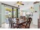 Dining area with a view to the kitchen and outdoor patio area at 329 Alegriano Ct, Kissimmee, FL 34758