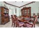 Dining room with a large wooden table, chairs, and classic china cabinet at 329 Alegriano Ct, Kissimmee, FL 34758