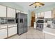 Spacious kitchen with white cabinets, stainless steel appliances, and tile flooring at 329 Alegriano Ct, Kissimmee, FL 34758
