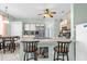 Bright kitchen featuring stainless steel appliances and a cozy breakfast bar with seating at 329 Alegriano Ct, Kissimmee, FL 34758