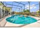 Sparkling pool with crystal-clear water and a screened enclosure perfect for relaxation and entertainment at 329 Alegriano Ct, Kissimmee, FL 34758