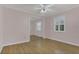Empty bedroom featuring hardwood floors and mirrored closet at 334 Terrace Dr, Oviedo, FL 32765