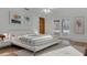 This staged bedroom has bright light, stylish décor, and an exit to the outdoor living space at 334 Terrace Dr, Oviedo, FL 32765