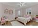 Bedroom with hardwood floors and natural light from a window at 334 Terrace Dr, Oviedo, FL 32765